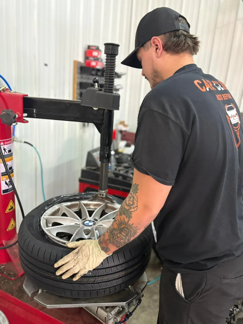 Car Clinic technician servicing a vehicle in the shop